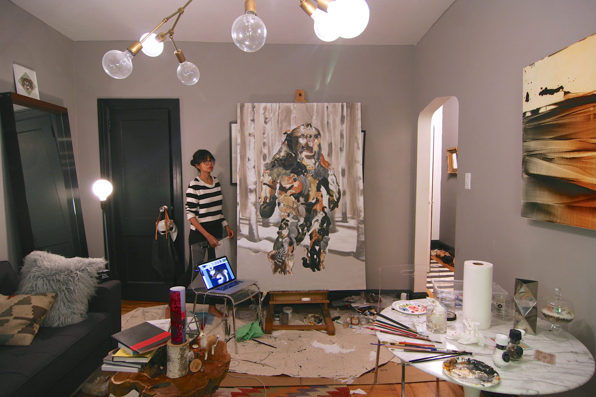 Shyama, painting in her living room until she finds a studio space!