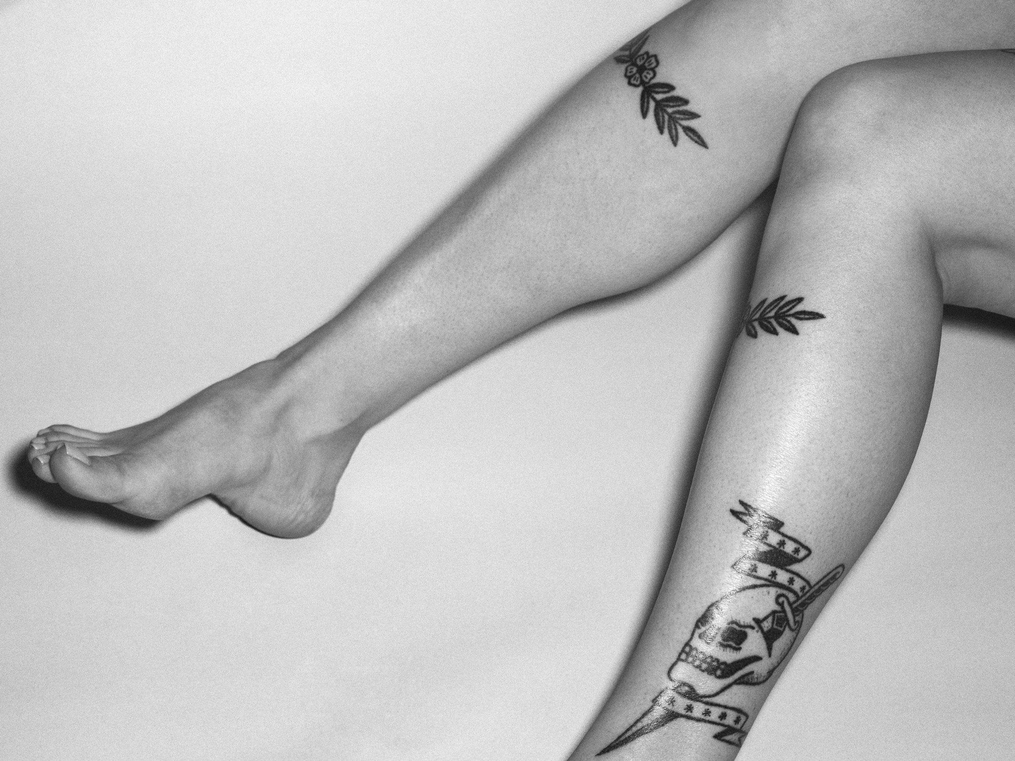 Tattoos on woman's legs