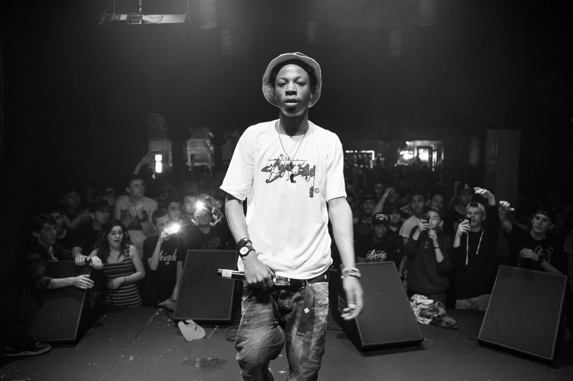 Joey Badass turns away from the crowd in San Diego