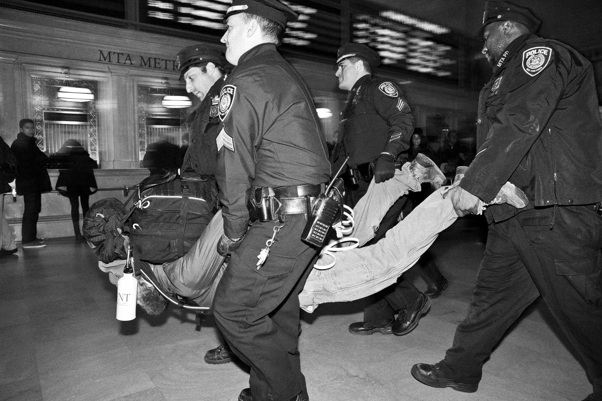 A protester is carried away by police during a peaceful Occupy Wall Street action in Grand Central Station