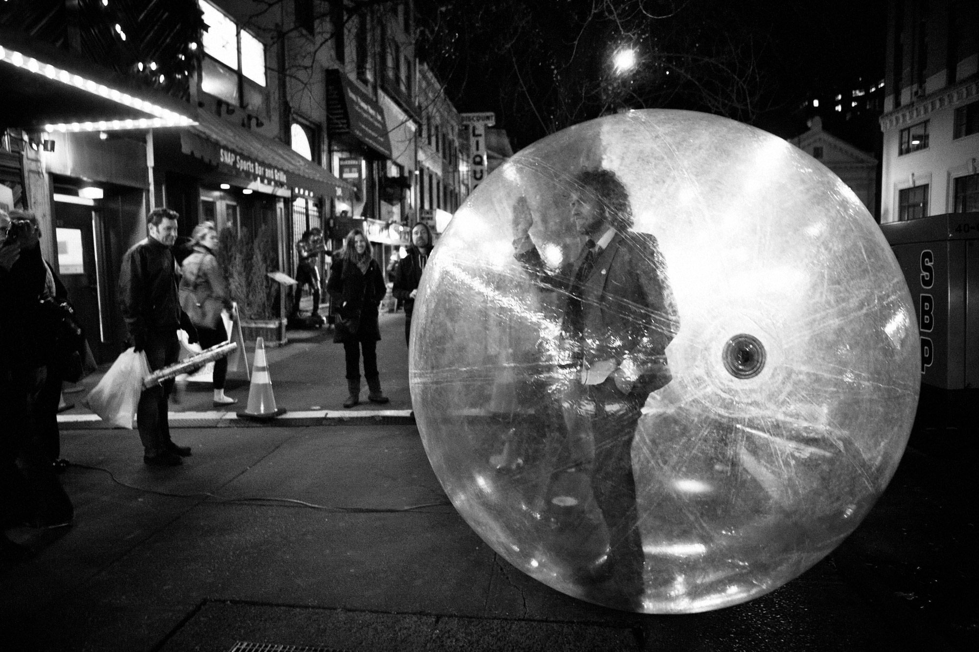 On 14th Street in New York, Wayne Coyne of the Flaming Lips tries out his bubble before his performance 