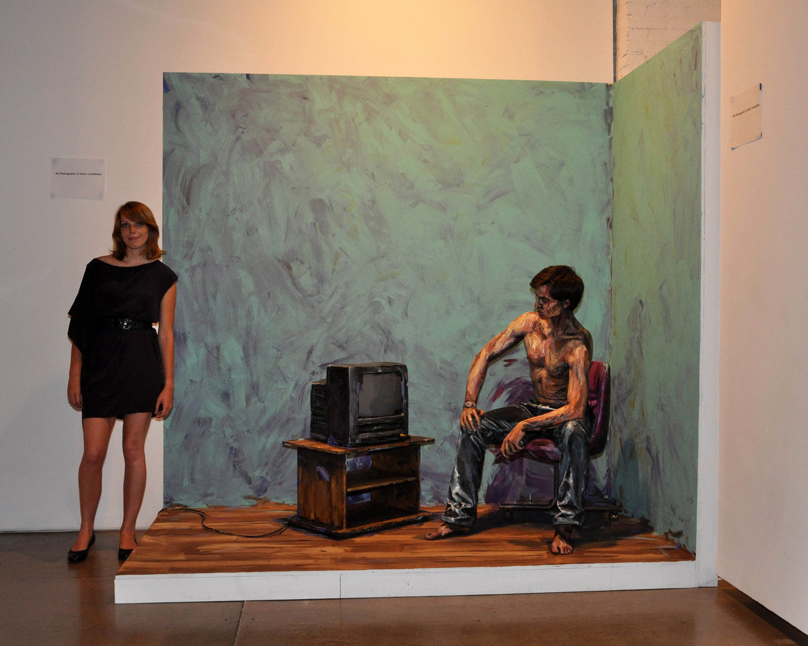 Mediation installation, Alexa stands next to her artwork, which appears 2-D when photographed