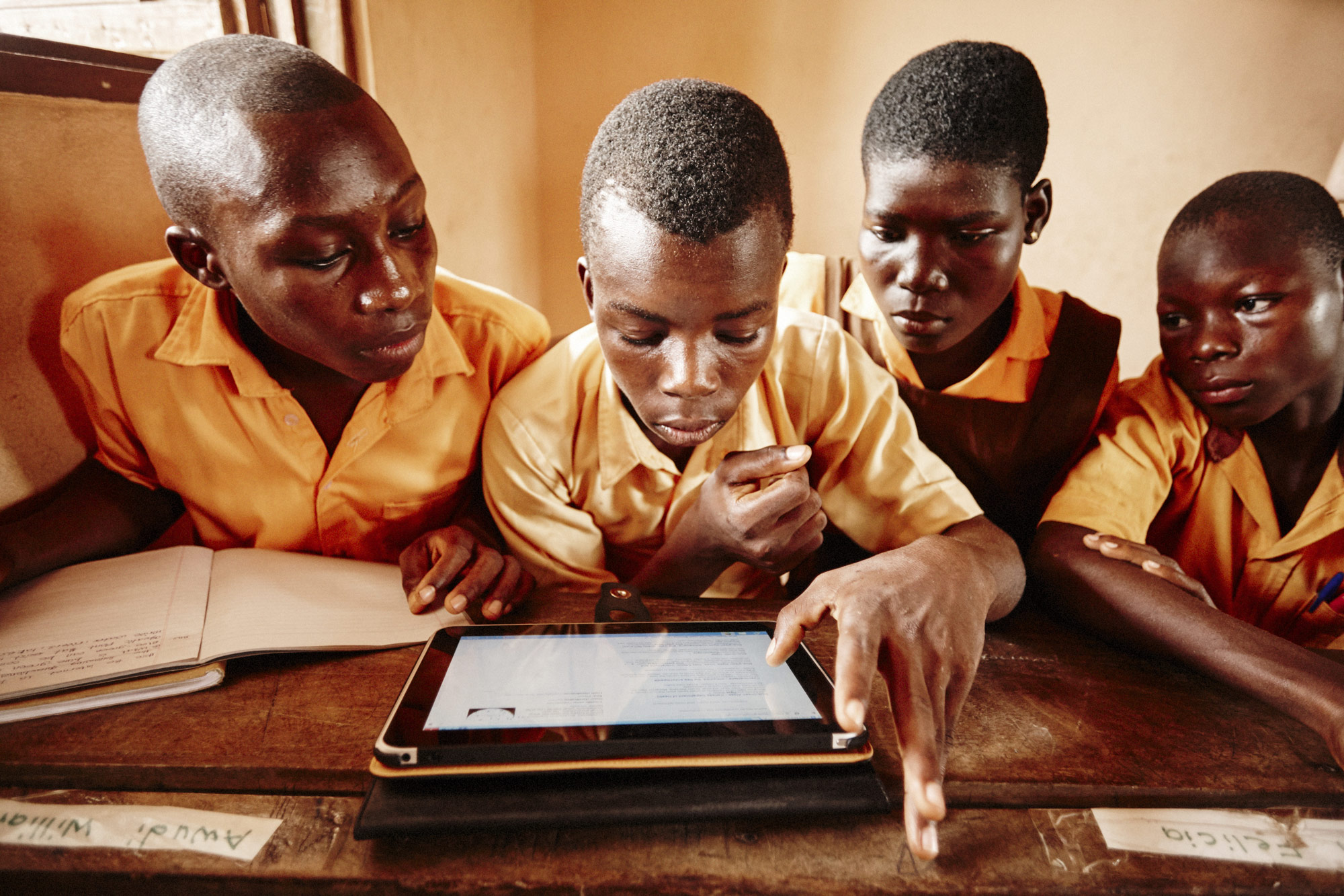 Ghana children in classroom with iPad