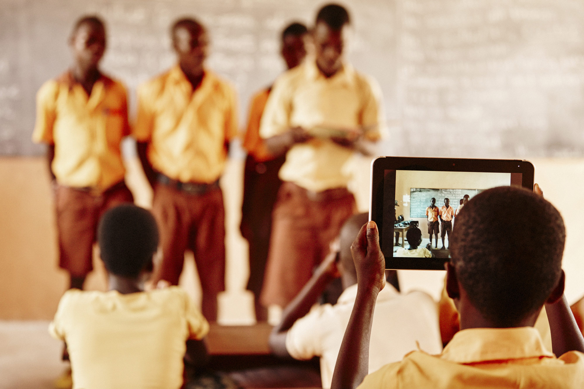 Ghana child with iPad in classroom
