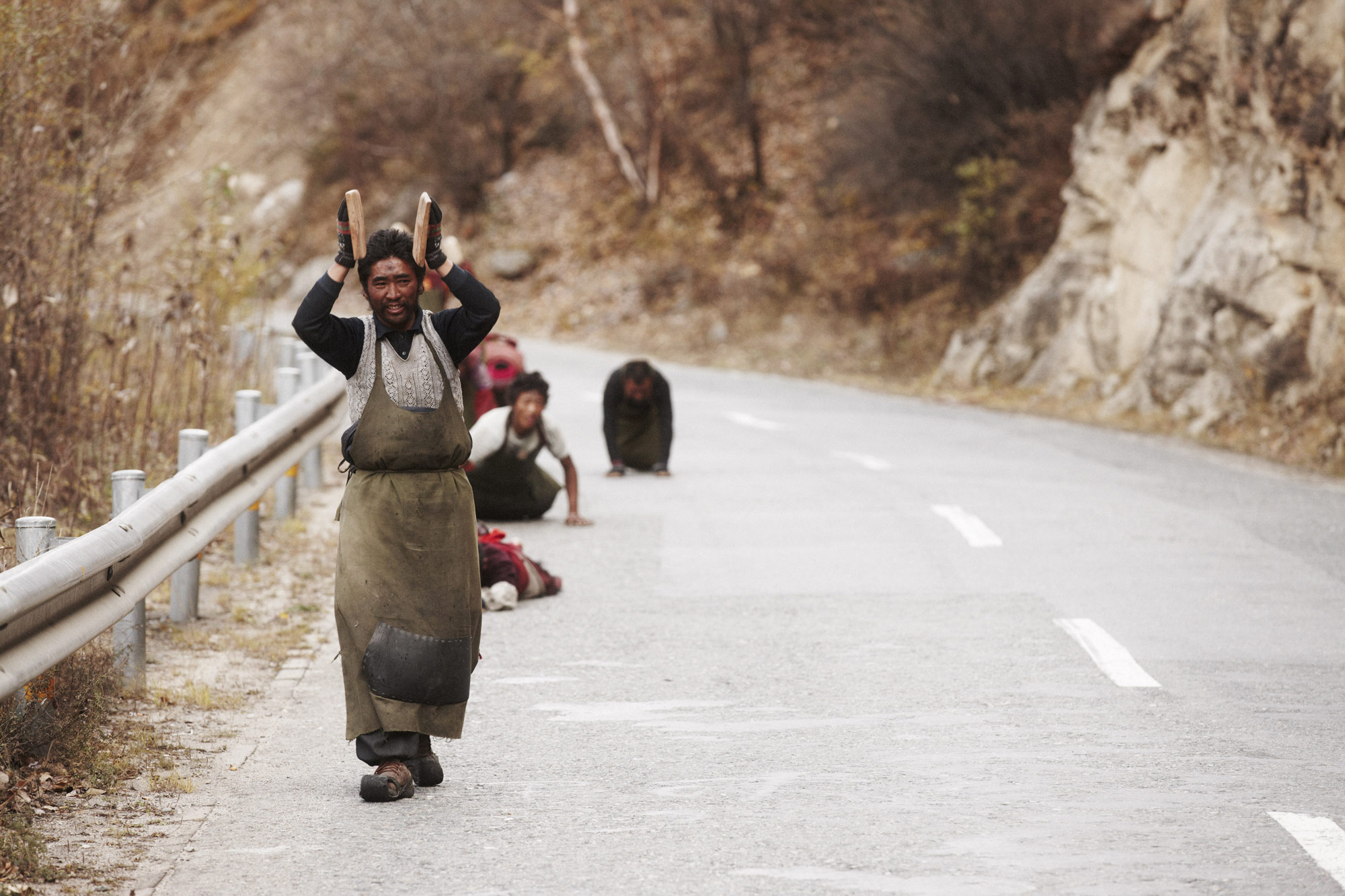 Tibet, 2011: Tibetan people walking on street
