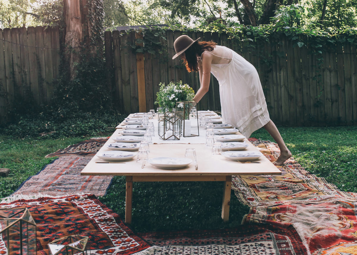Ruthie arranges flowers for a Free People dinner party