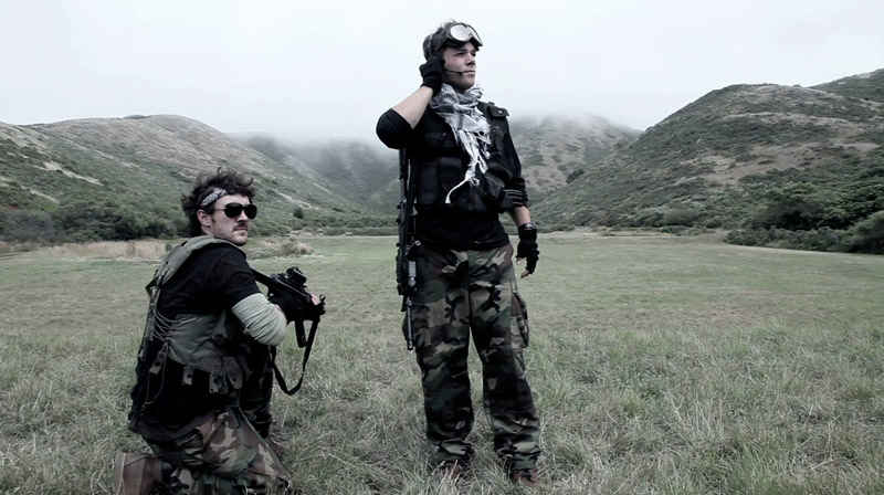 two army guys in a field with guns