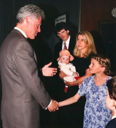 A young Cameron Russell shaking hands with President Clinton